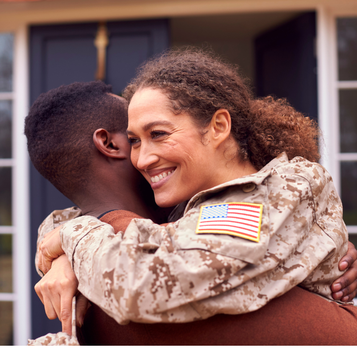 Soldier hugs friend 