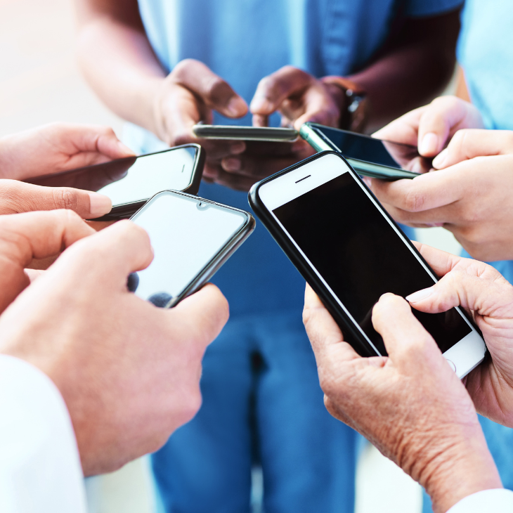 People holding their phone awaiting news 